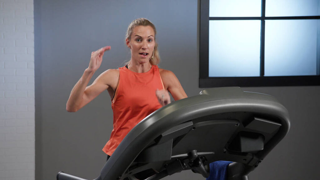Wellbeats instructor Carrie T. leads a running workout on the treadmill.